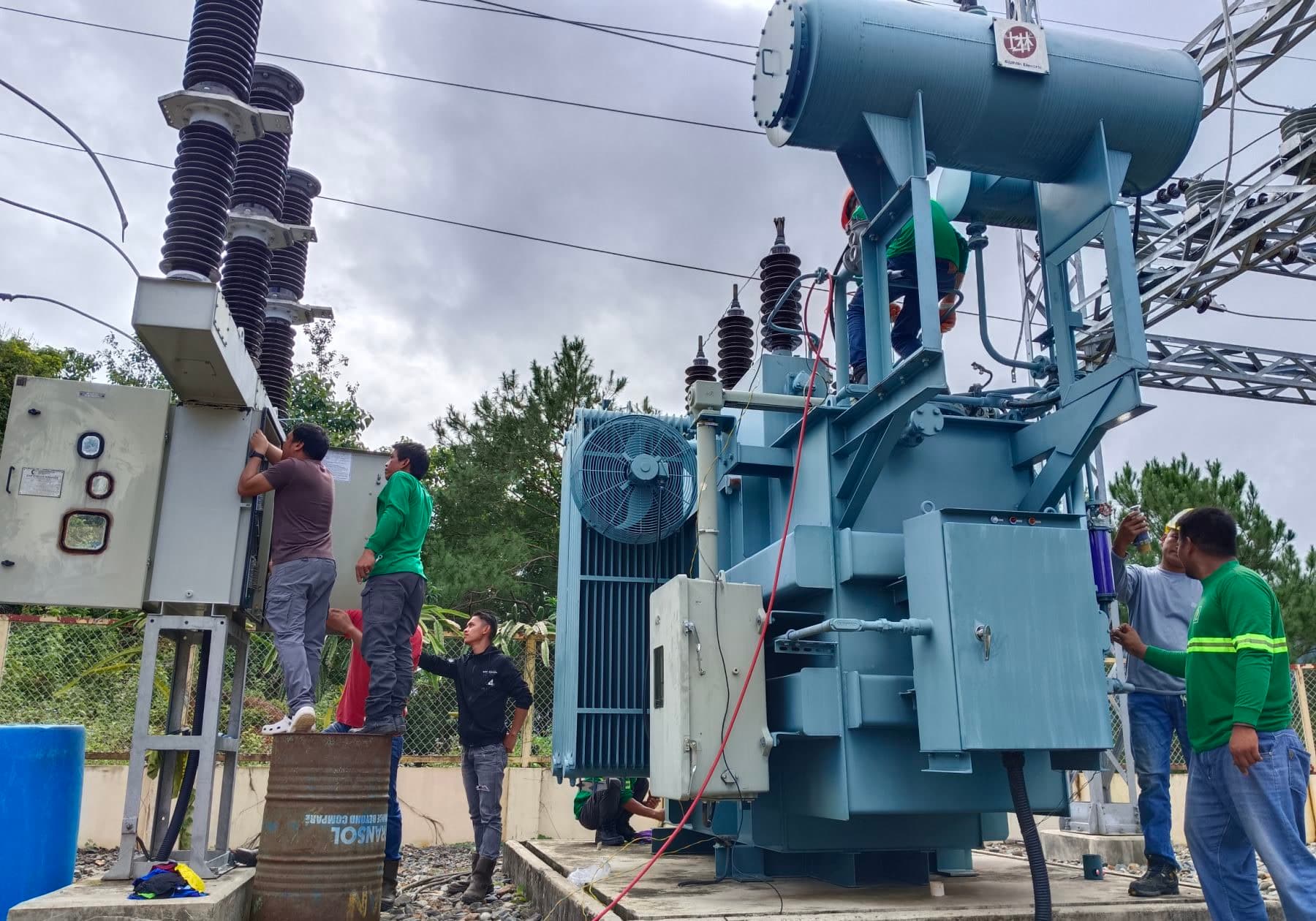 JC Electrofields crew installing a large power transformer at a mountain substation in Sagada